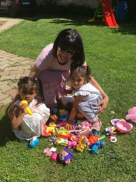 Alinda with two little girls who were recently adopted